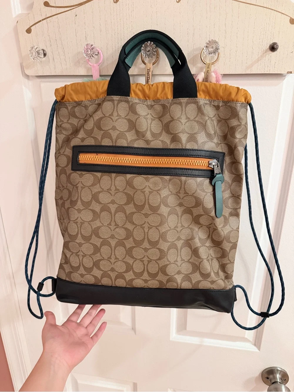 Coach Signature Logo Drawstring Backpack in Brown and Black
